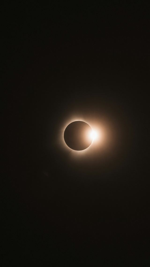 1290x2796 a solar eclipse in the dark sky -  iPhone Wallpaper