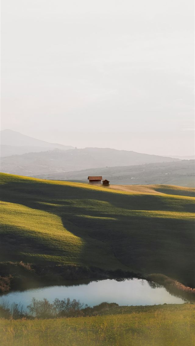 1290x2796 green grass field near lake under white sky during... -  iPhone Wallpaper