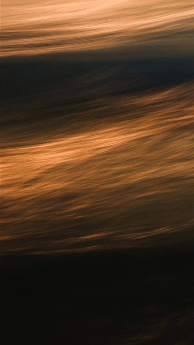 1290x2796 a blurry photo of a plane flying in the sky - beach iPhone Wallpaper