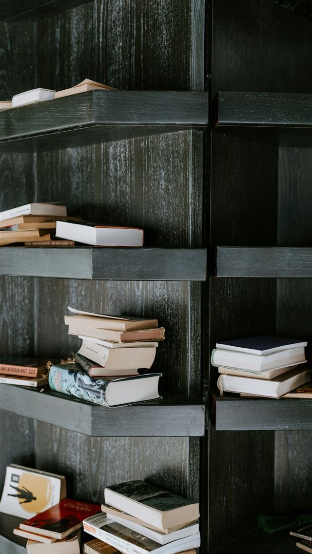 1290x2796 books on black wooden shelf -  iPhone Wallpaper