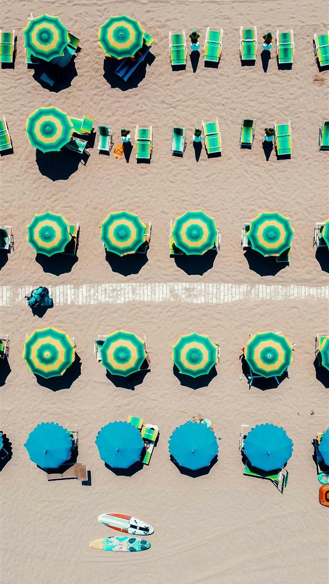 1290x2796 people on beach with blue and white umbrellas -  iPhone Wallpaper