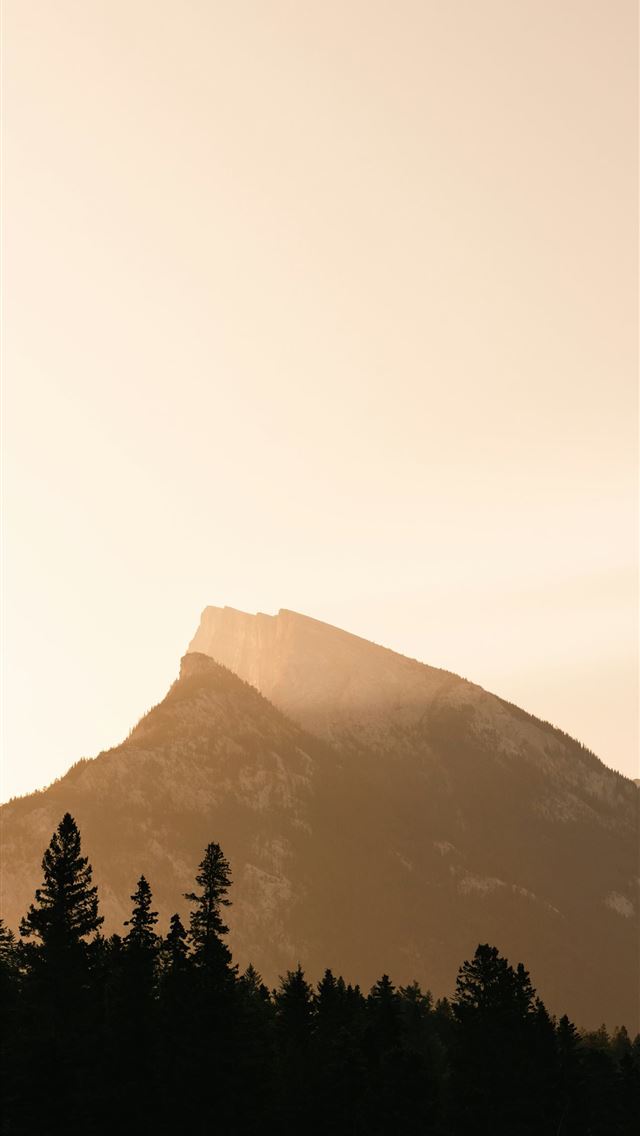 1290x2796 a large mountain with trees in the foreground - sunrise iPhone Wallpaper