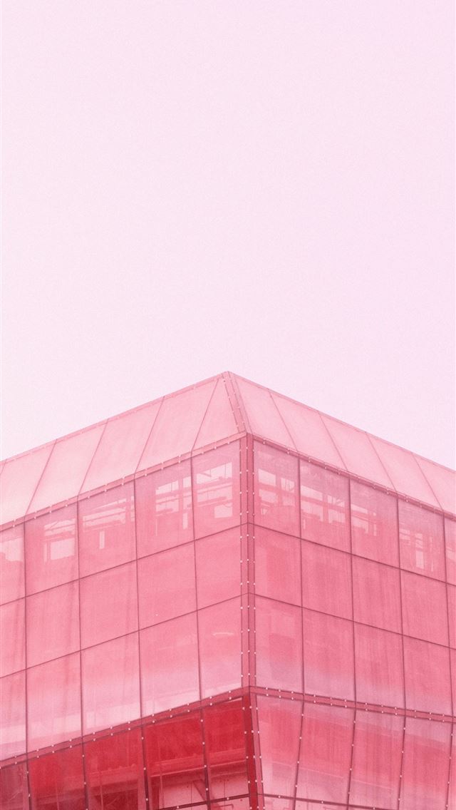 1290x2796 a red glass building with a clock on the top of it - city iPhone Wallpaper