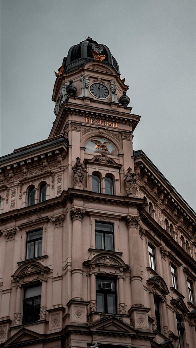 1290x2796 a tall building with a clock on the top of it - city iPhone Wallpaper