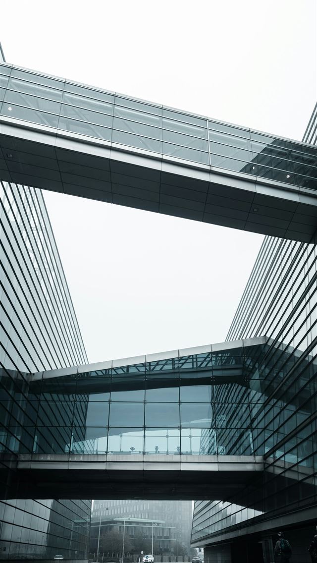 1290x2796 a couple of buildings that are next to each other -  iPhone Wallpaper