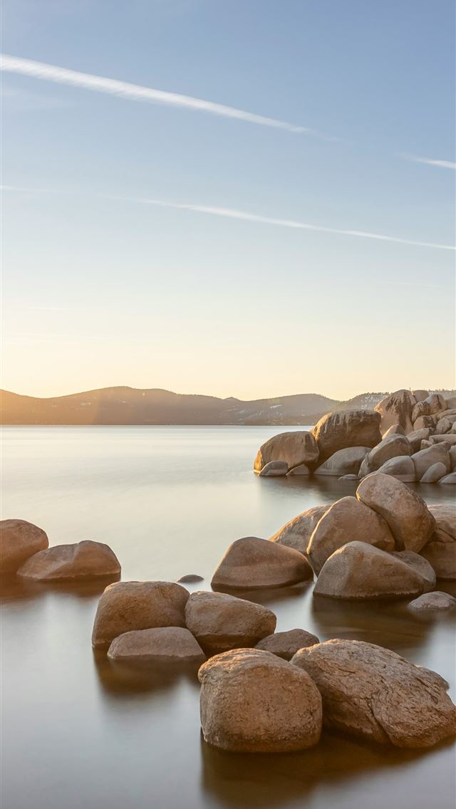 1290x2796 a large body of water surrounded by rocks - lake iPhone Wallpaper