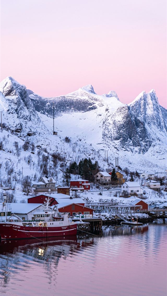 1290x2796 a boat is docked in the water in front of a snowy ... - sea iPhone Wallpaper