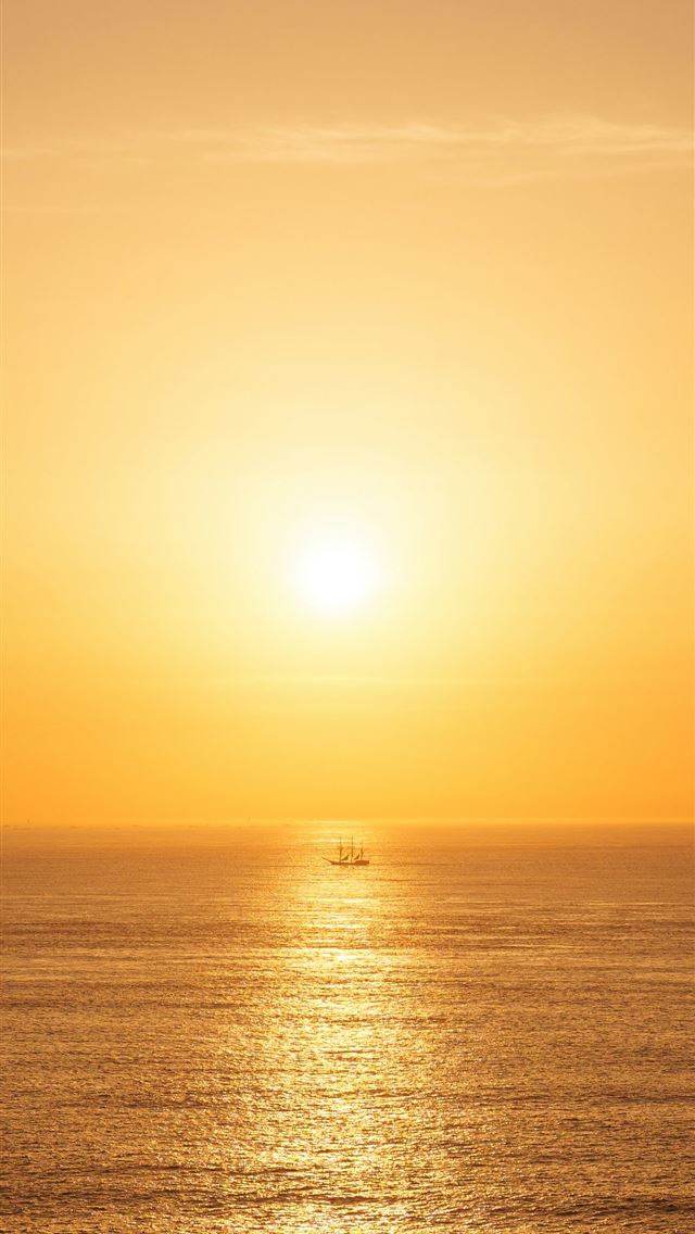 1290x2796 A small boat on the ocean at sunset  - sea iPhone Wallpaper
