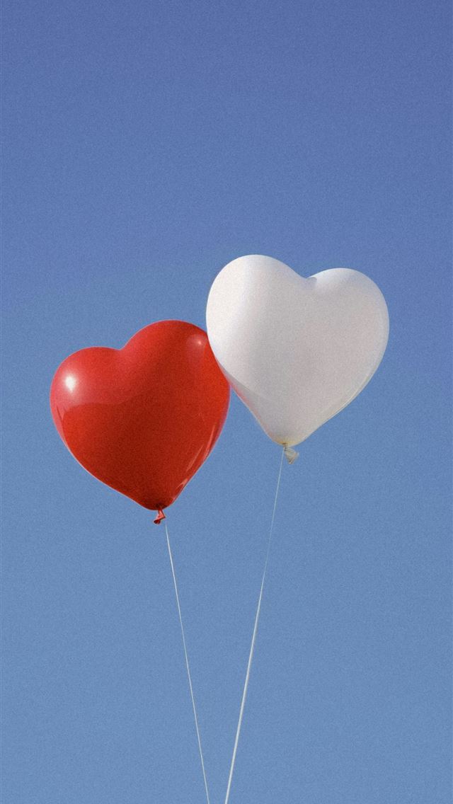 1290x2796 two heart shaped balloons floating in the air -  iPhone Wallpaper