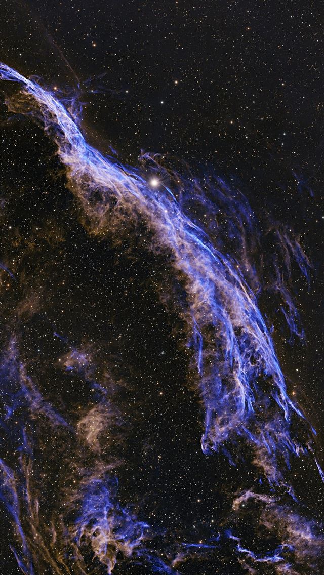 1290x2796 A wispy nebula glows with purple and orange hues  -  iPhone Wallpaper