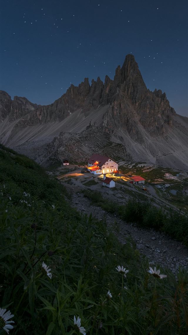1290x2796 Mountain refuge illuminated at night under starry ... - mountain range iPhone Wallpaper