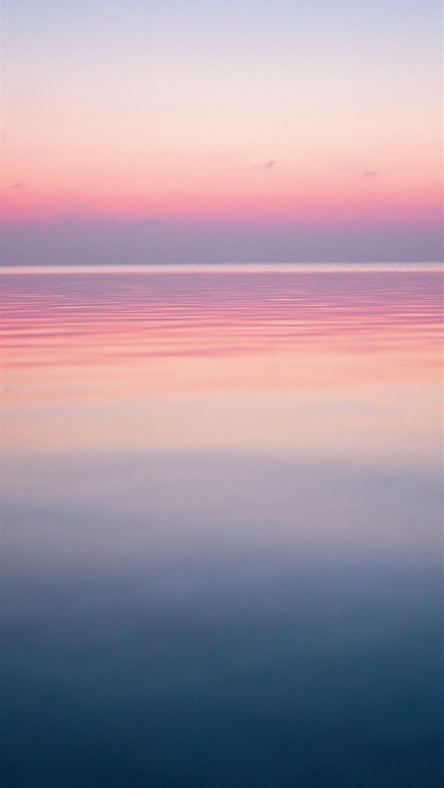 1290x2796 Pastel colored sky over calm ocean water - abstract iPhone Wallpaper