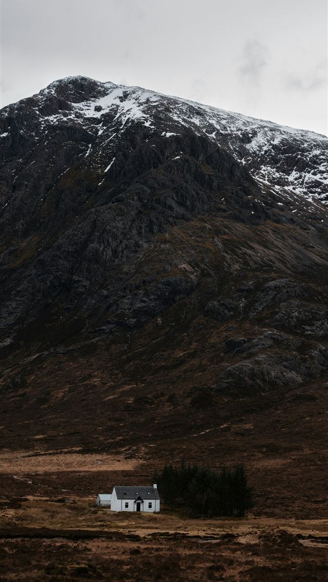 1290x2796 a house in the middle of a field with a mountain i... -  iPhone Wallpaper