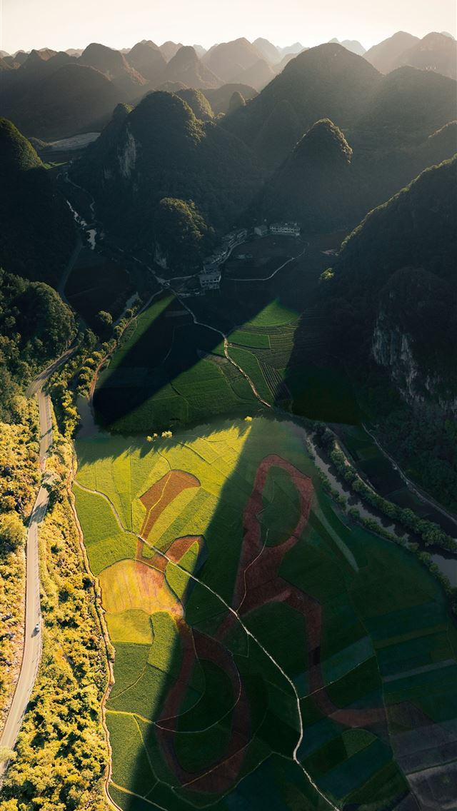 1290x2796 Aerial view of patterned fields amidst rolling hil... -  iPhone Wallpaper