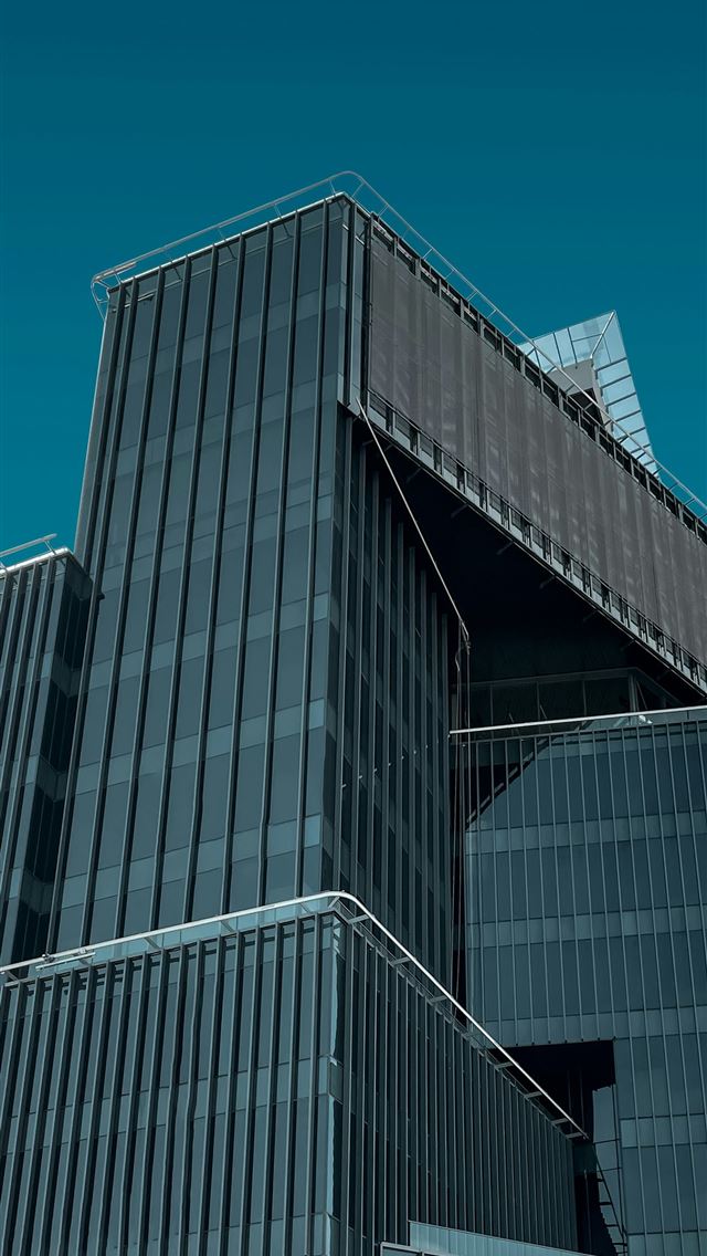 1290x2796 a very tall building with a clock on it's side - tower iPhone Wallpaper