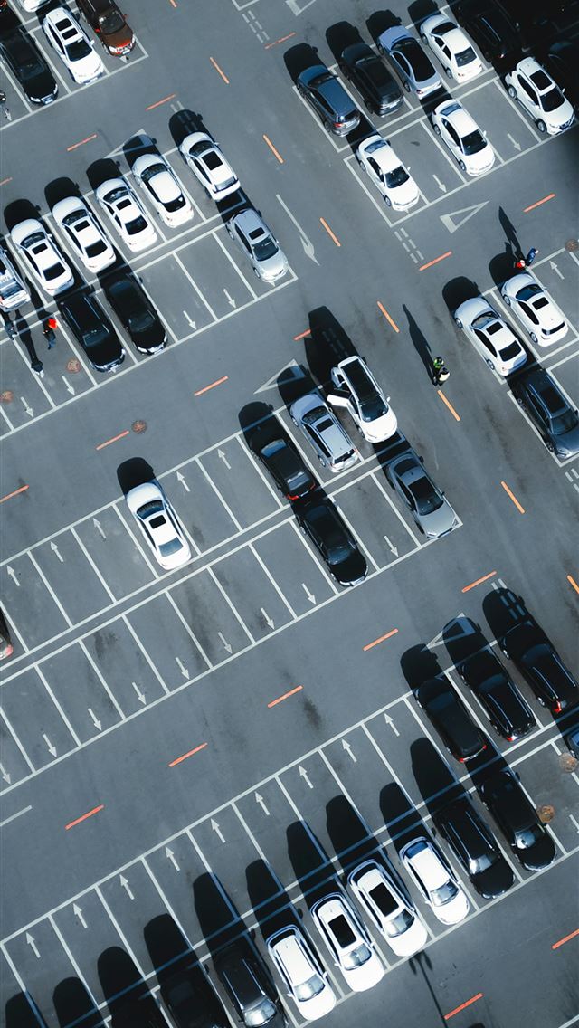 1290x2796 a parking lot filled with lots of parked cars -  iPhone Wallpaper