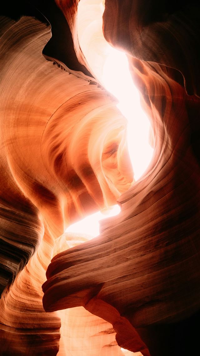 1290x2796 Light streams through a narrow sandstone canyon  -  iPhone Wallpaper
