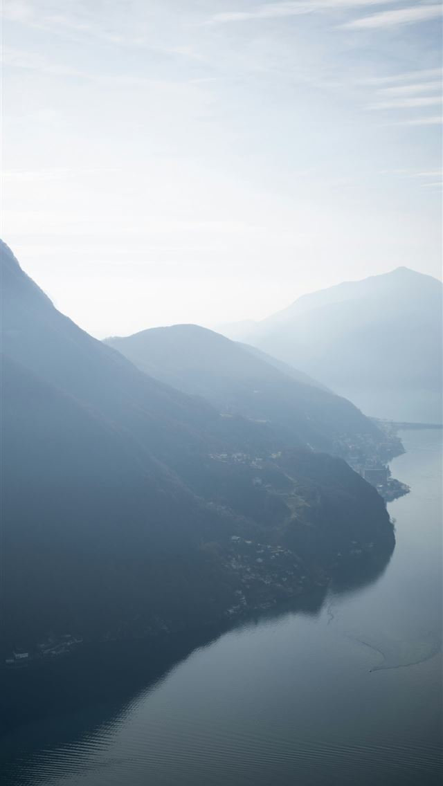 1290x2796 a body of water with mountains in the background - switzerland iPhone Wallpaper