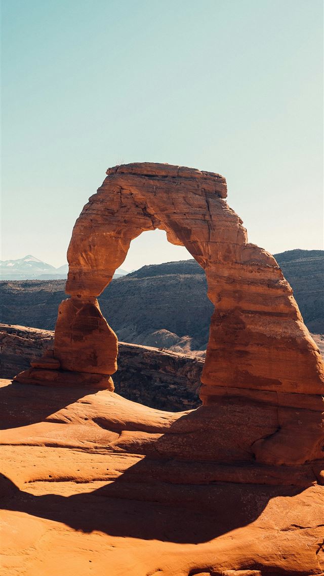 1290x2796 a large rock formation in the desert with Arches N... - desert iPhone Wallpaper