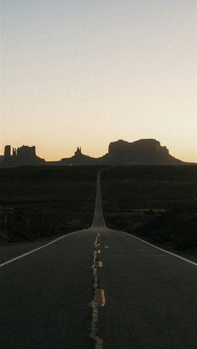 1290x2796 Desert highway leading to monument valley at sunse... - Travel iPhone Wallpaper