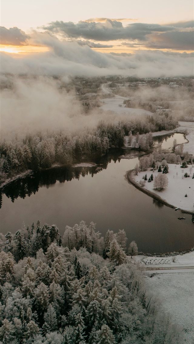 640x1136 Snowy forest surrounds a tranquil lake at sunrise  -  iPhone Wallpaper