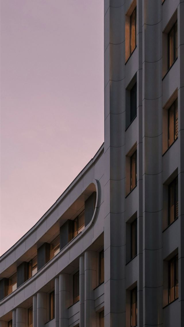 1125x2436 brown concrete building under blue sky during dayt... - architecture iPhone Wallpaper