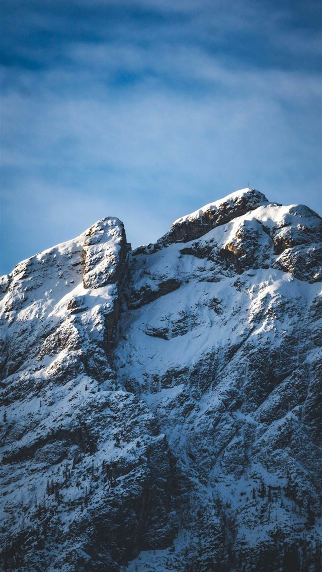 1290x2796 a mountain covered in snow under a blue sky -  iPhone Wallpaper