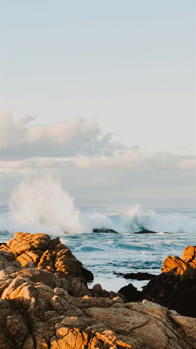 1290x2796 brown rock formations viewing body of water with b... - waves iPhone Wallpaper