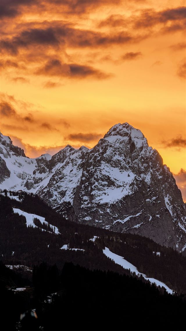 1290x2796 a mountain covered in snow under a cloudy sky -  iPhone Wallpaper