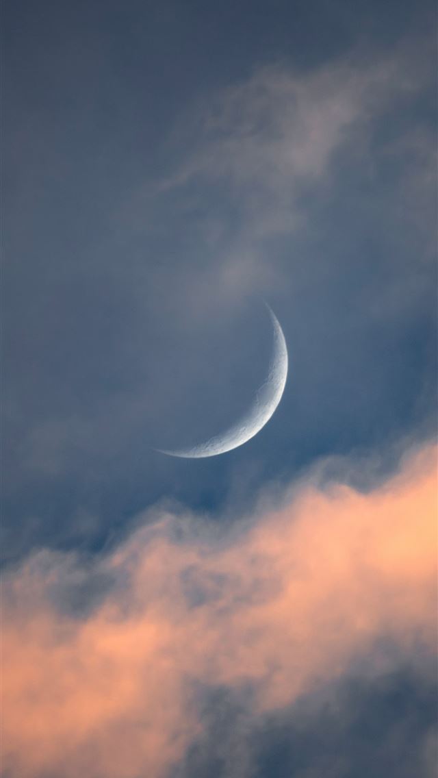 1290x2796 a crescent moon is seen through a cloudy sky -  iPhone Wallpaper