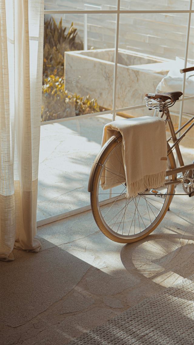 1290x2796 white bike near glass wall -  iPhone Wallpaper