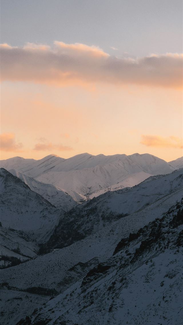 1290x2796 Snowy mountain valley at dusk with soft clouds  -  iPhone Wallpaper