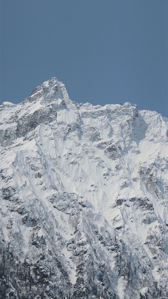 1290x2796 a large mountain covered in snow under a blue sky -  iPhone Wallpaper