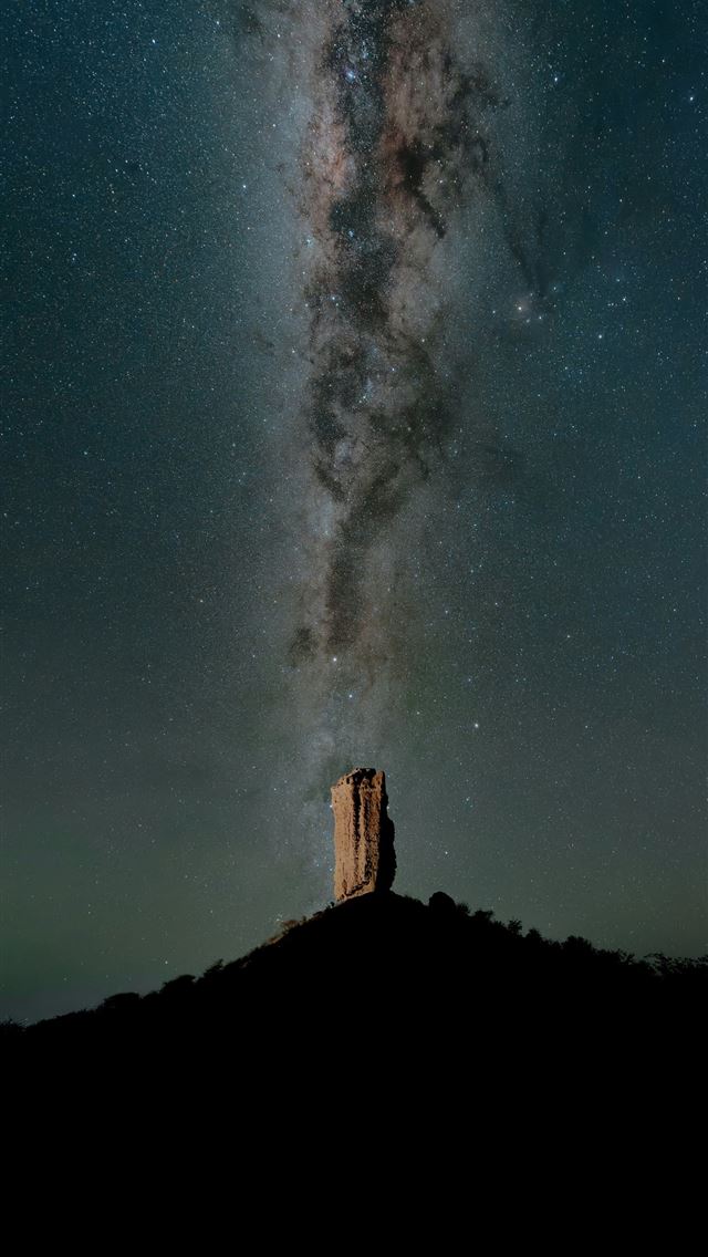 1290x2796 a person standing on a hill with a large explosion... -  iPhone Wallpaper