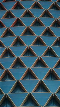 a close up of a building with many triangular shap... wallpaper
