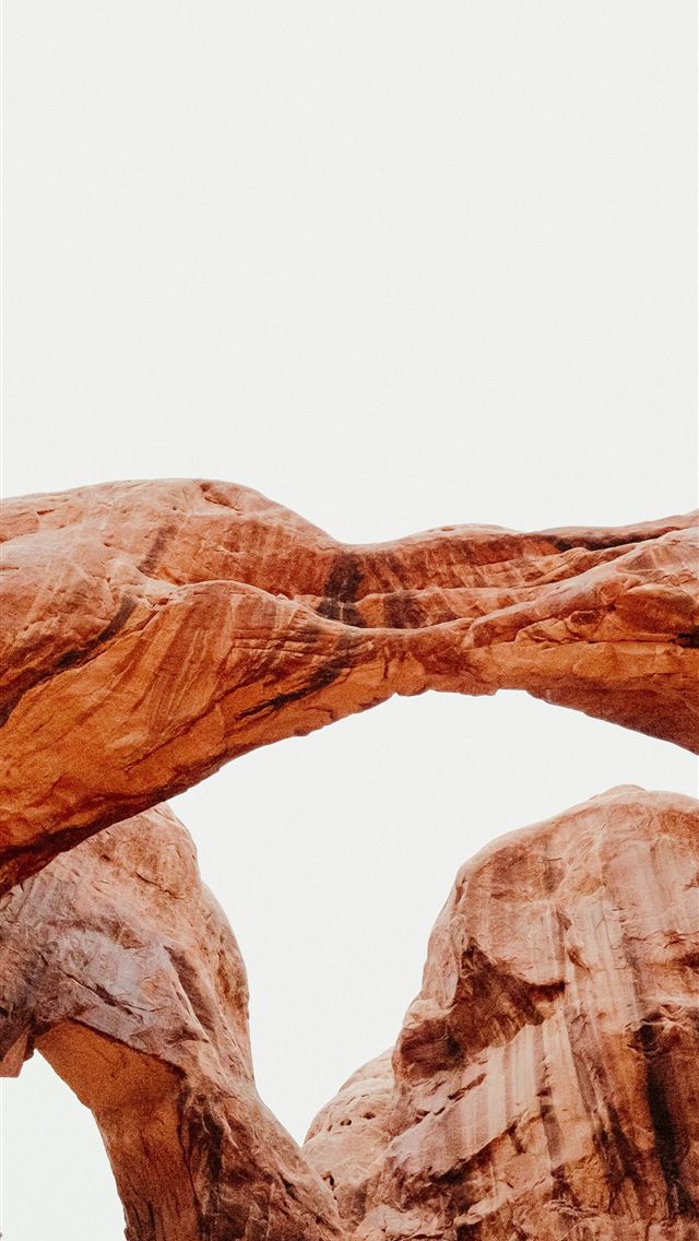 1290x2796 a large rock formation with a bird perched on top ... -  iPhone Wallpaper