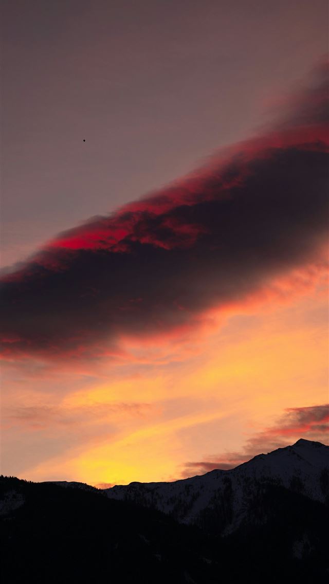 1290x2796 a red cloud is in the sky over a mountain -  iPhone Wallpaper