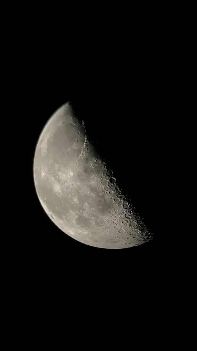 1290x2796 a close up of a half moon in the dark sky -  iPhone Wallpaper