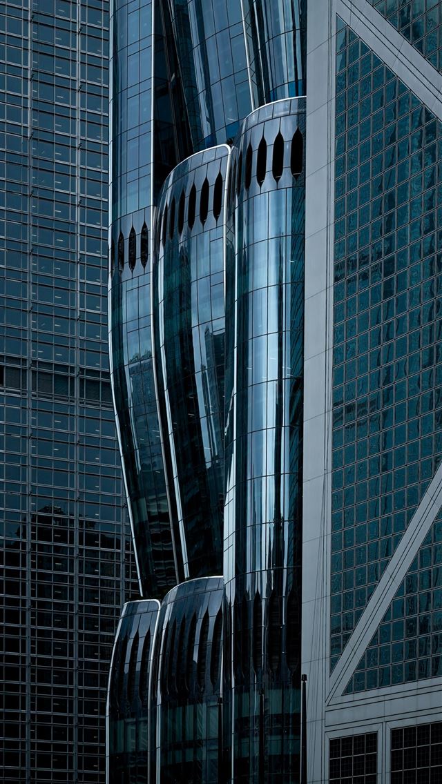 1290x2796 A very tall building with a lot of windows -  iPhone Wallpaper