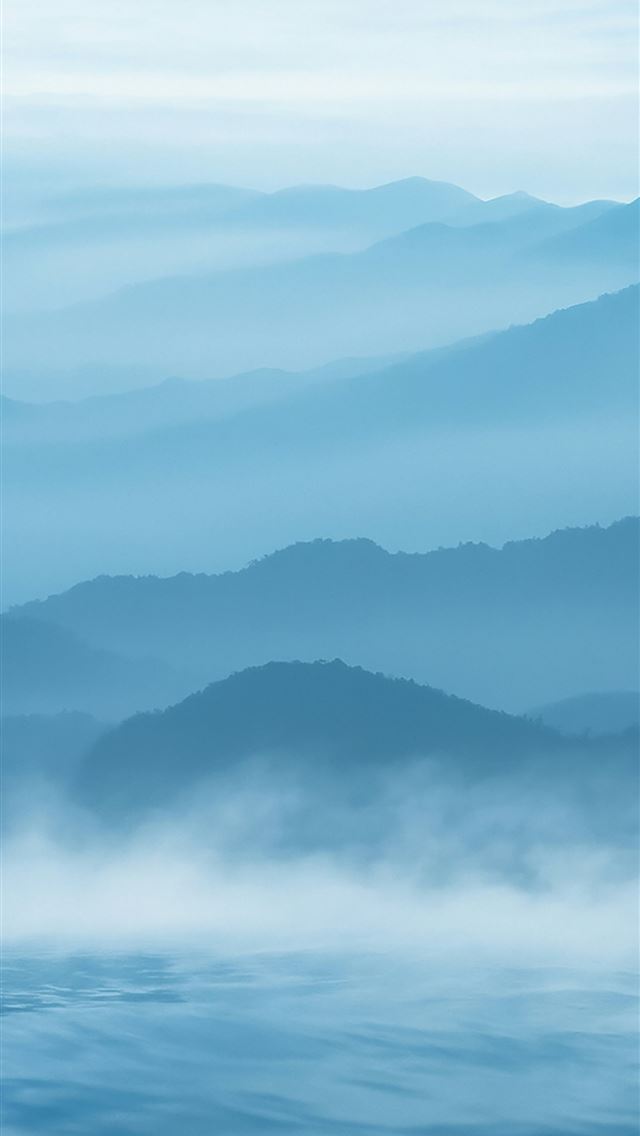 1290x2796 Misty blue mountains rise above calm water  -  iPhone Wallpaper