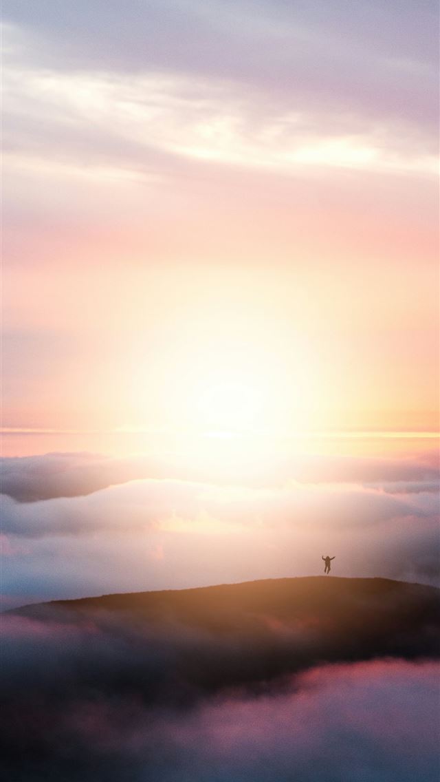 1290x2796 the sun is setting over the clouds in the sky -  iPhone Wallpaper