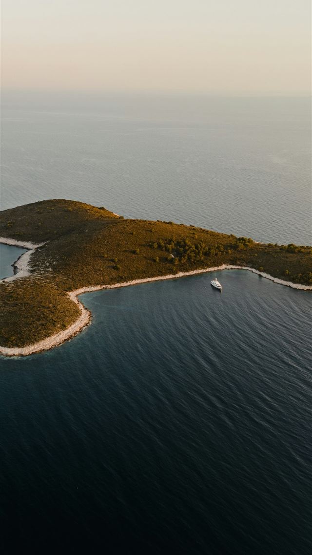 1290x2796 an island in the middle of the ocean - sea iPhone Wallpaper