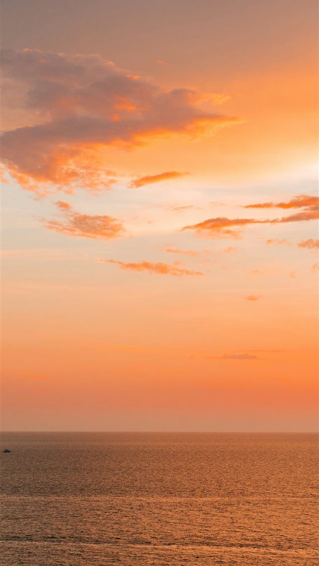 1290x2796 a sunset over the ocean with a boat in the distanc... - sunset iPhone Wallpaper