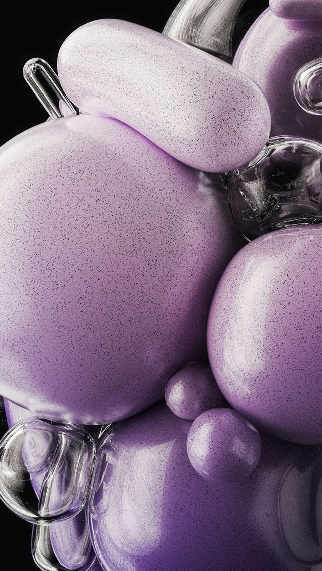 1290x2796 a glass vase filled with lots of purple balls -  iPhone Wallpaper