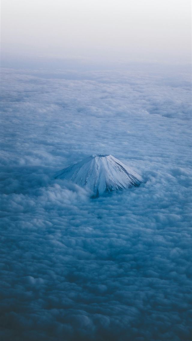 1290x2796 Snow capped mountain peak emerges from clouds belo... -  iPhone Wallpaper