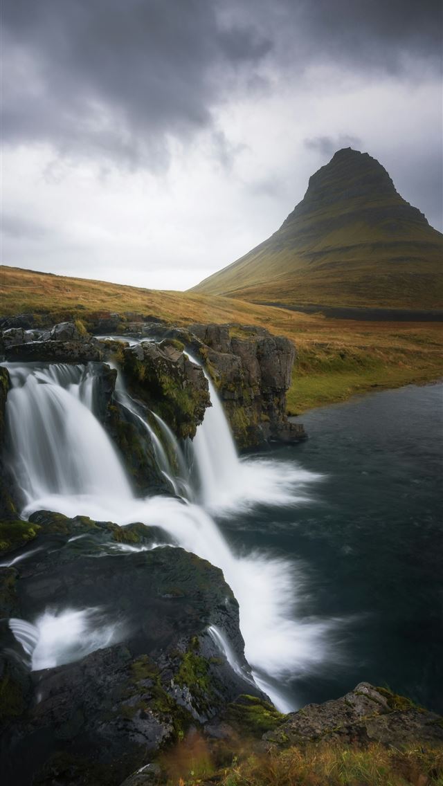 1290x2796 Waterfall flowing near a distinctive mountain unde... - iceland iPhone Wallpaper