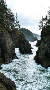 landscape photography of outcrop near body of wate... wallpaper
