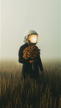 a person in a field with a light on their head wallpaper