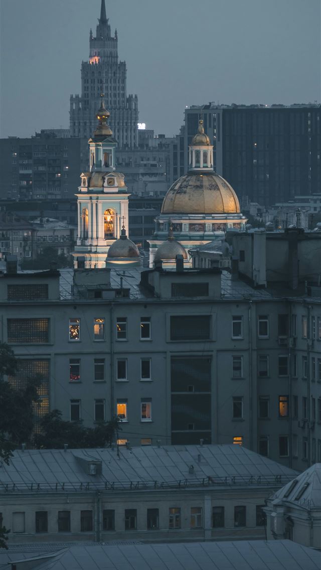 1290x2796 gray concrete building under gray sky -  iPhone Wallpaper