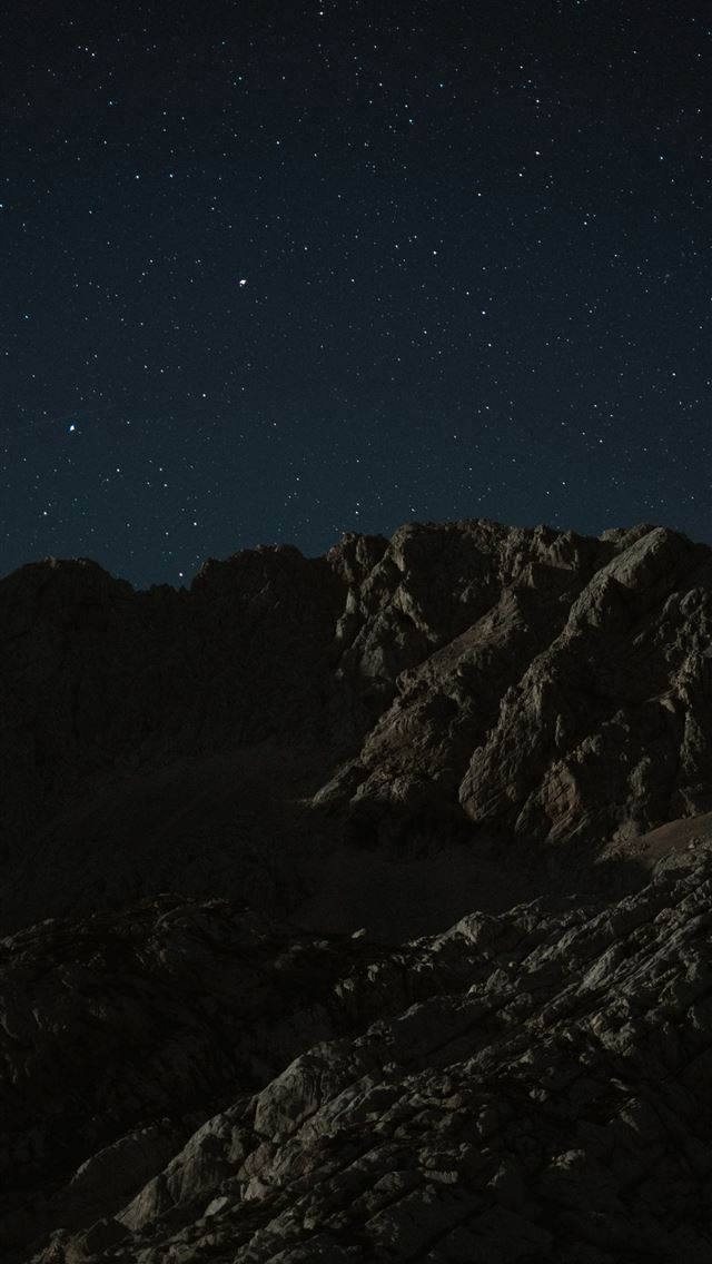 1290x2796 snow covered mountain under blue sky during night ... - universe iPhone Wallpaper